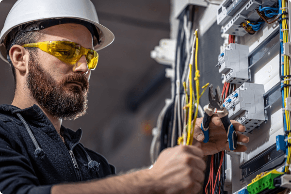 an engineer working on circuit breakers